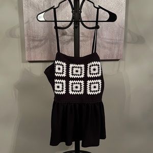 Crocheted, black-and-white, tank top with adjustable straps.
